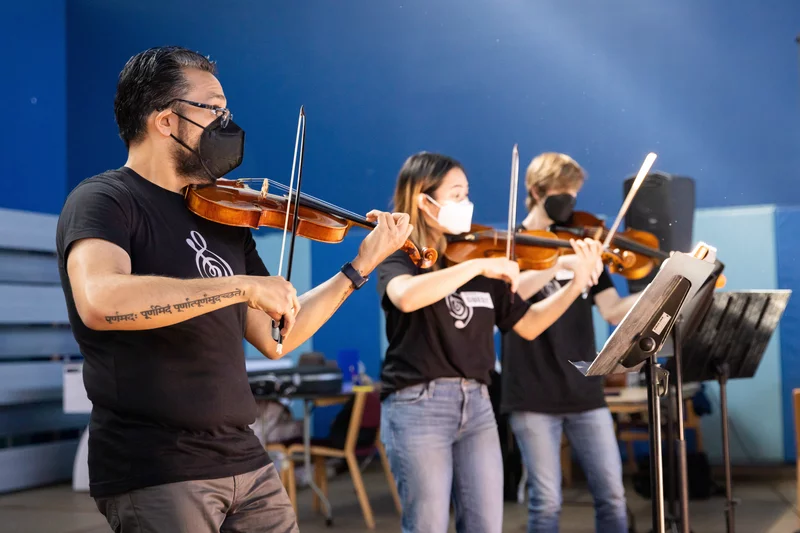 Vijay Gupta performing with some of the professional musicians in Street Symphony at the Midnight Mission on LA's Skid Row.